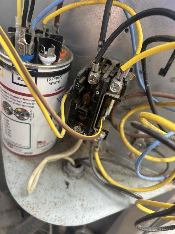 Responded to no cooling complaint on residential air conditioning system. Upon arrival, inspected outdoor condensing unit and found system operational but performing electrical diagnostics. Removed access panel and inspected electrical components including contactor, capacitor, and wiring connections. Verified capacitor rated at 6.0 MFD and checked all terminal connections for proper voltage and secure mounting. Inspected condenser coil fins and noted unit showing normal wear for age. All electrical connections tested and secured, system restored to normal cooling operation.