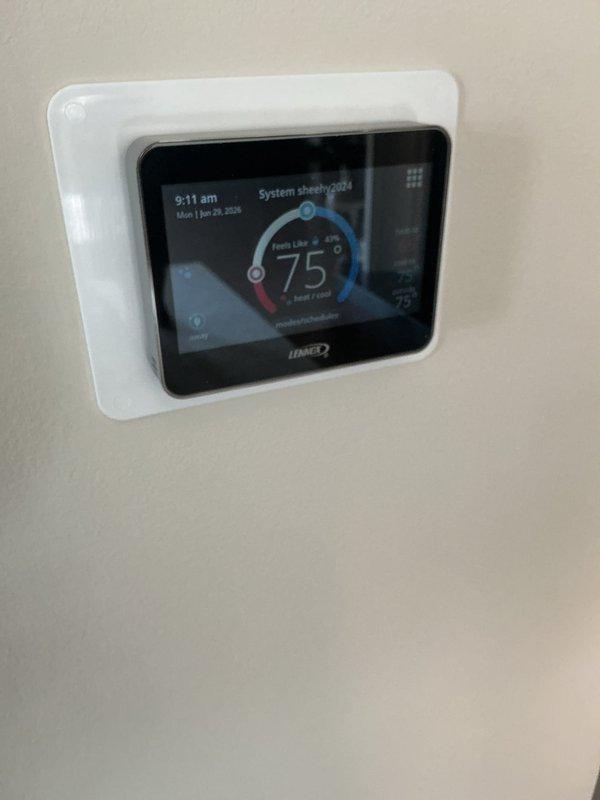 Completed annual basic cooling maintenance visit on Lennox HVAC system. Performed comprehensive inspection of furnace and cooling components, including examination of internal mechanical and electrical systems, refrigerant lines, and brass fittings with copper connections. Observed rust/corrosion staining on interior metal housing seam requiring monitoring for future service intervals. Verified thermostat operation and system functionality, confirming proper temperature control at 75°F setpoint. All system components operational upon completion of preventive maintenance protocol.