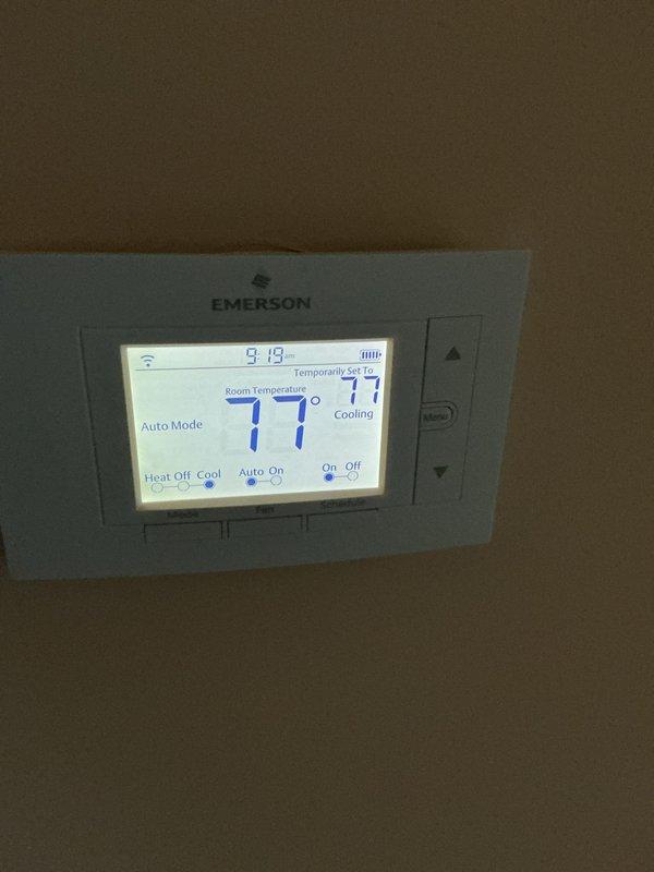 Completed routine cooling maintenance inspection on HVAC system. Checked and evaluated air filter condition, noting 20x25x4 filter size not included in standard service package. Verified thermostat operation showing system running in auto mode with cooling active at 77°F setpoint. All equipment inspected and photographed for service records.