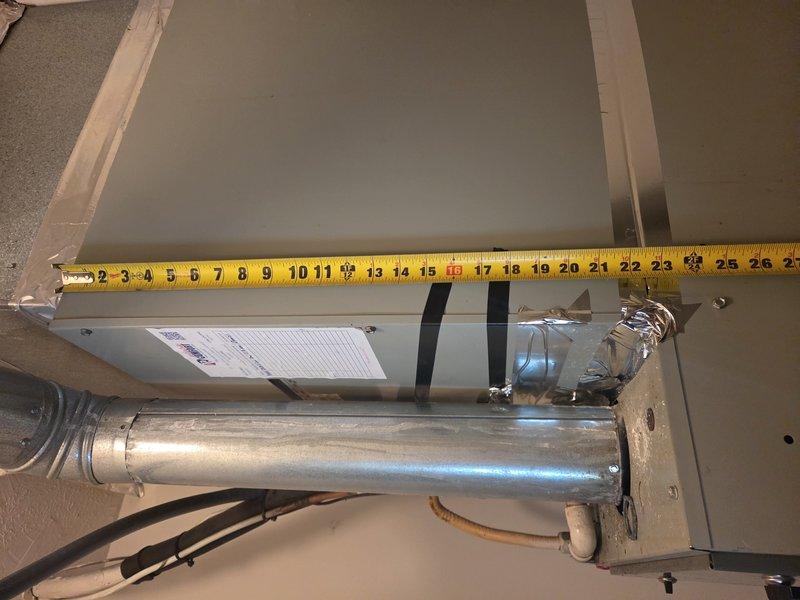 Responded to service call for non-operational air conditioning system. Conducted site assessment and documented existing HVAC equipment dimensions for coil replacement evaluation. Measured air handler unit width at approximately 24 inches and assessed ductwork configuration, including vertical duct run measuring approximately 8 inches in the photographed section. Equipment located in attic space with existing metallic duct connections and drain components visible. Provided photographic documentation and measurements to facilitate accurate coil pricing and replacement planning prior to proceeding with repair work.