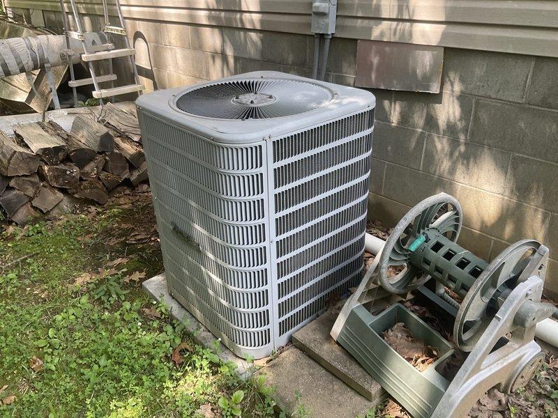 Completed full system replacement estimate for aging 4-ton R22 Ducane HVAC system experiencing low refrigerant levels and inadequate cooling performance. Evaluated existing vertical air handler installation in utility closet and outdoor condenser unit, both showing signs of age and operating with obsolete R22 refrigerant. Documented equipment specifications, measured system capacity requirements, photographed current installations, and provided comprehensive replacement options to address refrigerant phase-out concerns and restore reliable climate control to the residence.