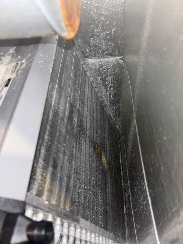 Completed basic monthly cooling maintenance visit on HVAC system. Inspected evaporator coil and found significant accumulation of dust, dirt, and debris on fins and surrounding surfaces, which can reduce system efficiency and airflow. Documented electrical panel condition showing proper wiring connections, circuit breakers, contactors, and control board operation.