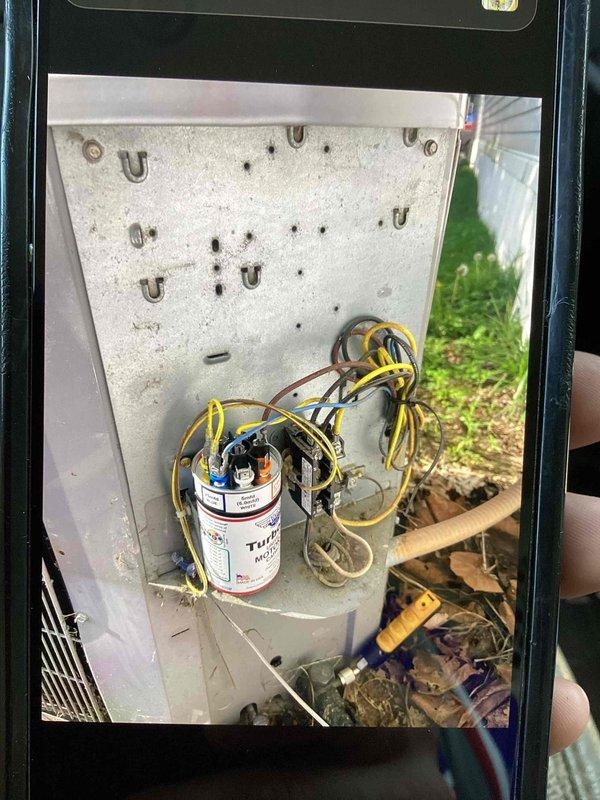 Responded to no-cooling complaint with outdoor unit not operating. Upon inspection, found failed capacitor in outdoor condensing unit with debris accumulation in cabinet. Replaced defective capacitor, cleaned debris from control cabinet, verified proper electrical connections, and tested system operation to confirm cooling restored.
