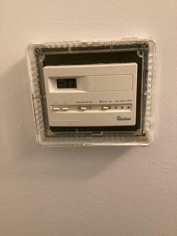 Responded to no cooling complaint with warm air discharge from supply registers. Upon arrival, found thermostat displaying error code and outdoor disconnect junction box with deteriorated wiring connections. Inspected thermostat operation and outdoor electrical connections. Documented existing conditions showing compromised wire terminations and debris accumulation in exterior junction box affecting system operation.