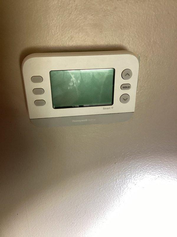 Responded to service call for non-operational HVAC system after customer self-installed new Honeywell Home Smart thermostat. Verified correct service address, inspected thermostat wiring and configuration at wall-mounted unit, and examined furnace/air handler equipment in mechanical room to diagnose system failure. Corrected thermostat installation issues and restored system to proper working condition.