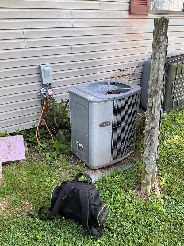 Completed comprehensive monthly maintenance on Carrier cooling system. Performed standard inspection procedures including thermostat operation verification at 71°F, checked refrigerant pressures using manifold gauges, inspected outdoor condenser unit for proper airflow and electrical connections at disconnect box, and installed 14x20x1 air filter per service agreement. All system components operating within normal parameters with no deficiencies noted.