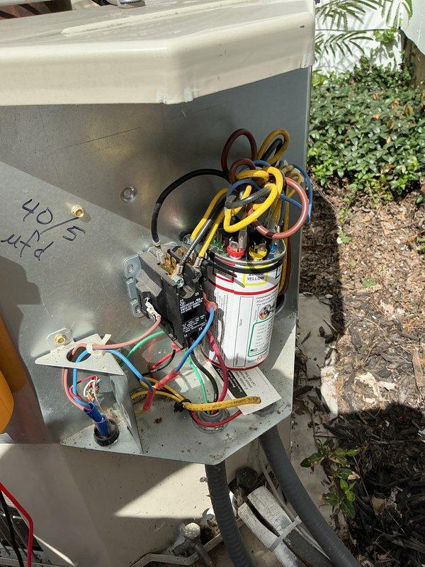 Completed basic monthly cooling maintenance visit on residential HVAC system. Inspected outdoor condensing unit including Yellow Jacket capacitor, contactor relay, electrical connections, and refrigerant line set with proper coil configuration. All components operating within normal parameters with no immediate service needs identified.