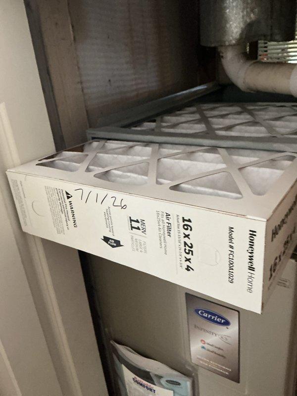 Completed basic monthly cooling maintenance visit on Carrier HVAC system. Inspected air filtration system with existing 16x25x4 MERV 11 Honeywell filter in place, verified system operation, and recorded ambient temperature reading of 74°F at unit location.