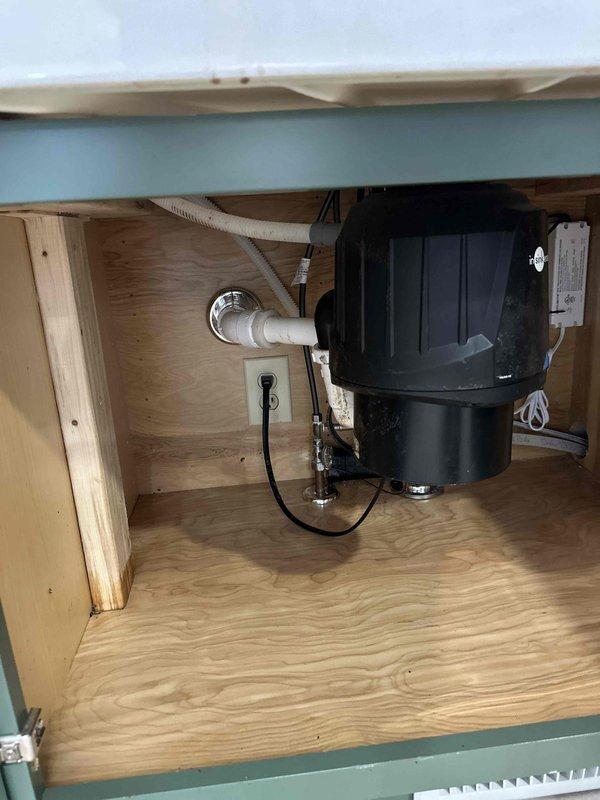 Responded to recurring kitchen drain line clog issue. Successfully ran snake through the kitchen drain line from the disposal connection point, clearing the obstruction in the line that connects to the laundry room. The main drain line was not affected. Customer reports this maintenance is typically required every 2-3 years due to buildup in this specific section of the drainage system.