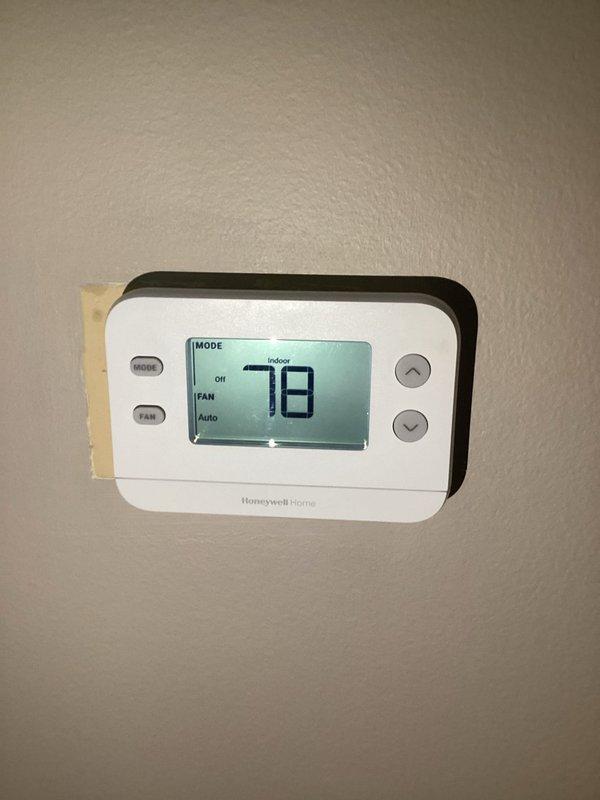 Responded to no cooling complaint on residential air conditioning system. Upon arrival, found outdoor condenser unit installed against brick exterior wall with landscaping. Performed diagnostic evaluation of system operation and checked refrigerant levels. Noted previous leak seal application from prior service visit and verified warranty status on materials. Completed full maintenance service including cleaning condenser coils, inspecting electrical connections at disconnect box, and verifying proper airflow through condenser fan. Checked thermostat operation and confirmed temperature settings at indoor unit. System restored to proper cooling operation with all components functioning within normal parameters.