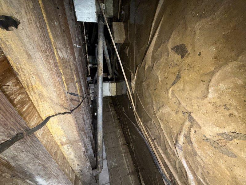 Conducted complimentary second opinion assessment for catastrophic water heater failure. Upon arrival, found significant structural and material damage consistent with water heater rupture in confined installation space. Inspection revealed extensive moisture damage to surrounding wooden framing members, with visible deterioration including fiber separation, vertical water staining, and potential decay. Metal piping and conduit in immediate vicinity showed surface oxidation and corrosion from water exposure. Documented conditions through photographic evidence of wall cavity damage, deteriorated lumber, and affected plumbing infrastructure. Provided professional estimate for complete water heater replacement and necessary repairs to compromised structural components and water-damaged materials.