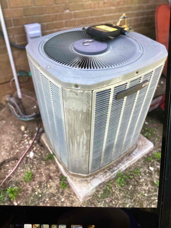 Responded to a free second opinion request for a 25-year-old Trane air conditioning system experiencing freeze-up conditions and complete loss of cooling capacity. Performed diagnostic evaluation of the outdoor condenser unit, documenting unit condition and manufacturer information including serial number and manufacturing date of January 2002. Assessed system performance and provided customer with findings regarding the aged equipment's operational status.