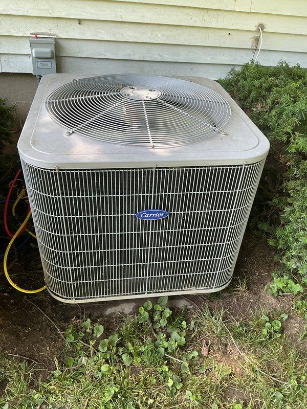 Completed basic cooling visit and annual maintenance on Carrier air conditioning system. Performed routine inspection of outdoor condenser unit, verified proper operation of all components, and checked system temperatures at the air handler. Standard 20x20x4 filter was not included per service agreement terms.