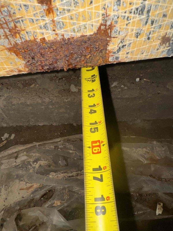 Responded to water damage caused by leaking water heater that saturated ductwork in crawl space. Assessed and measured damaged section of duct board (approximately 10x12) showing extensive moisture infiltration, rust corrosion, and material deterioration. Documented conditions and measurements for replacement of compromised duct board section and supply takeoff, with install crew scheduled to return to complete ductwork replacement.