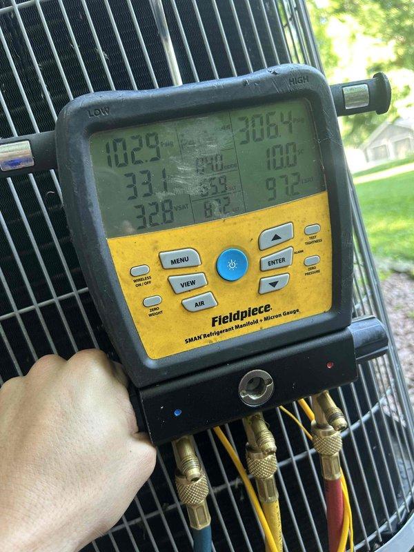 Responded to complaint of AC not cooling adequately. Upon arrival, connected Fieldpiece SMAN digital manifold gauges to outdoor condenser unit and performed complete refrigerant system diagnostics. Measured and recorded superheat, subcooling, and system pressures to evaluate refrigerant charge and overall system performance. System operational at time of inspection with reduced cooling capacity confirmed through temperature and pressure analysis.