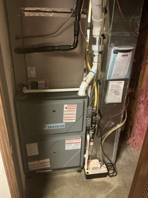 # HVAC Maintenance - Cooling System Service

Completed annual basic cooling maintenance visit on residential Amana outdoor condensing unit and Daikin indoor furnace system. Performed comprehensive inspection of outdoor unit electrical components including control board, capacitor, contactor, and all associated wiring connections. Verified proper operation of all electrical controls and safety devices. Inspected indoor equipment installation including ductwork connections, PVC condensate drainage system, and gas line routing.

All components found operating within normal parameters. System tested and confirmed functional for cooling season operation. Customer has active comfort club agreement renewing 12/5/26. Noted that 16x25x4 filter size is not included in service agreement and remains customer's responsibility for replacement.