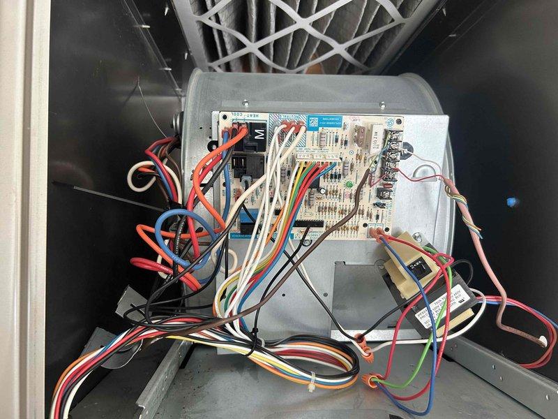 Responded to no cooling call on residential air conditioning system. Upon arrival, found thermostat displaying 89°F with system calling for cooling but unit not operating. Performed diagnostic evaluation of HVAC control board and wiring connections within air handler cabinet. Inspected control board components, relay functions, and low voltage wiring terminations. Documented system conditions and prepared membership estimate for necessary repairs to restore cooling operation.