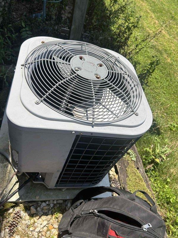 Responded to no cooling complaint on 12-year-old heat pump system. Upon arrival, inspected outdoor condenser unit and accessed indoor air handler control board to diagnose loss of cooling. Performed system evaluation, documented equipment condition including control board wiring and connections, and identified cause of cooling failure for necessary repairs.