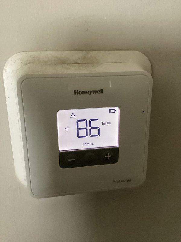 Responded to no cooling call where air conditioning system was making noise but not operating. Upon arrival, found Honeywell ProSeries thermostat set to OFF mode with fan running continuously. Verified outdoor condenser unit had power at disconnect but was not engaging. Cycled thermostat to cooling mode and confirmed proper call for cooling, restoring normal system operation and resolving customer concern.