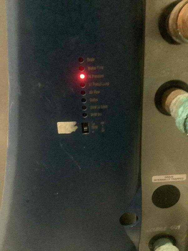 Responded to emergency no-cooling call at residential property. Upon arrival, performed diagnostic evaluation of HVAC system and inspected electrical control panel and circuit board assembly. Documented control board configuration, terminal block connections, and system wiring for electrical components including capacitor and safety controls with trip alert indicators.