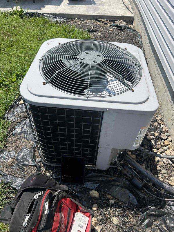 Responded to no cooling complaint on residential air conditioning system less than 10 years old. Upon arrival, inspected outdoor condenser unit and found system operational with fan running properly. Removed and examined air filter, which showed moderate debris accumulation and restriction. Replaced dirty air filter with new filter to restore proper airflow and system efficiency. Verified unit operation and confirmed adequate cooling restored to occupied space.