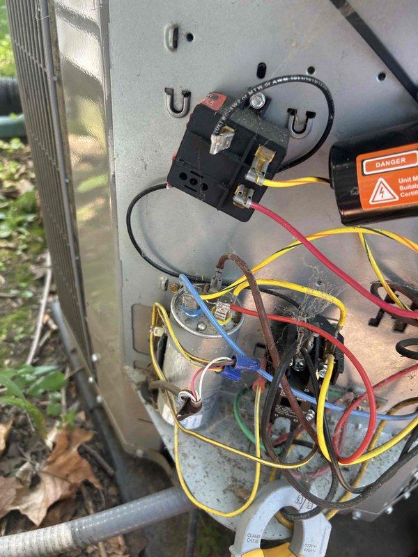 Responded to no cooling complaint on aging outdoor condensing unit. Upon inspection, found electrical control panel with disorganized wiring, aged capacitor, and contactor showing signs of extended service life and outdoor weathering. Inspected all electrical connections, tested capacitor for proper microfarad rating and voltage, and verified contactor operation. Evaluated condenser coil condition and overall system functionality. Unit restored to operational status with all electrical components functioning within specifications.