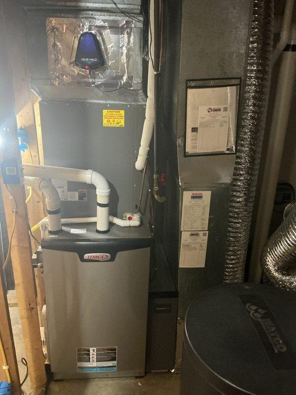# HVAC Maintenance - Cooling System Service

Performed comprehensive cooling system maintenance on residential Lennox furnace and air handler unit. Conducted thorough inspection of all accessible components including blower motor assembly, gas valve, heat exchanger, and control board. Verified proper operation of PVC condensate drainage system and intake/exhaust venting configuration.

Inspected electrical connections, wire harnesses, and circuit board for signs of wear or damage. Examined blower compartment and confirmed adequate airflow through ductwork system. Checked flame sensor and heat sink components for proper positioning and cleanliness. Verified all safety labels and manufacturer specifications remain visible and legible on equipment.

Completed standard preventive maintenance protocol per manufacturer guidelines. System operational and functioning within normal parameters at time of service completion. Customer advised that 20x25x4 filter replacement not included in basic m
