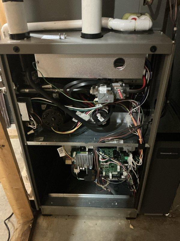 # HVAC Maintenance - Cooling System Service

Performed comprehensive cooling system maintenance on residential Lennox furnace and air handler unit. Conducted thorough inspection of all accessible components including blower motor assembly, gas valve, heat exchanger, and control board. Verified proper operation of PVC condensate drainage system and intake/exhaust venting configuration.

Inspected electrical connections, wire harnesses, and circuit board for signs of wear or damage. Examined blower compartment and confirmed adequate airflow through ductwork system. Checked flame sensor and heat sink components for proper positioning and cleanliness. Verified all safety labels and manufacturer specifications remain visible and legible on equipment.

Completed standard preventive maintenance protocol per manufacturer guidelines. System operational and functioning within normal parameters at time of service completion. Customer advised that 20x25x4 filter replacement not included in basic m