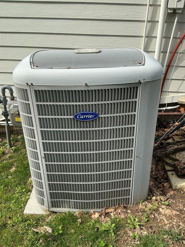 Completed comprehensive preventative maintenance tune-up on 11-year-old Carrier heat pump system. Inspected outdoor condenser unit, verified proper operation of all components, checked refrigerant levels, cleaned coils, and tested electrical connections. All systems operating within manufacturer specifications with no deficiencies noted.