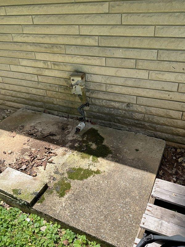 Conducted comprehensive assessment of existing HVAC system for complete replacement estimate. Evaluated aging air handler unit located in interior utility closet, noting significant dust accumulation, deteriorated surfaces, and overall equipment condition indicating end of service life. Documented existing vertical installation configuration with metal ductwork, refrigerant lines with partial insulation degradation, and confined access space within closet area. Inspected exterior mechanical components and noted evidence of moisture exposure and weathering on building foundation and surrounding areas. Provided detailed replacement system recommendations and equipment options suitable for the existing installation footprint and configuration.
