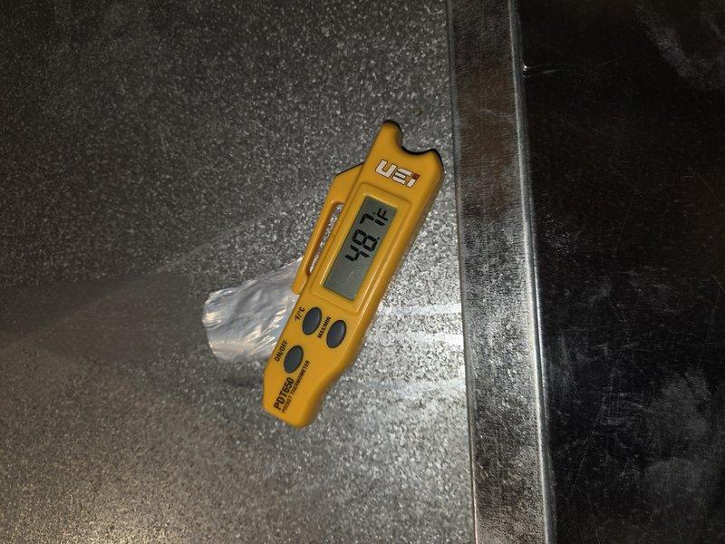 Responded to callback for thermostat connectivity issues and incomplete maintenance. Diagnosed thermostat server connection failure and caution alert display. Verified system humidity levels at 74.8% using digital hygrometer and checked system pressures with gauge readings. Completed remaining maintenance items that were unable to be finished during previous visit due to missing materials. Adjusted thermostat settings closer to customer's preferred temperature of 1 degree differential. System restored to normal operation with proper connectivity established.