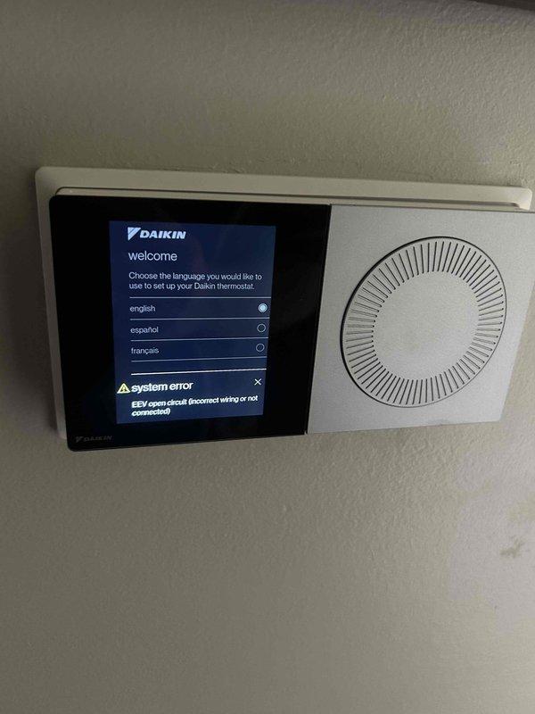 Responded to service call for AC system unable to reach setpoint of 72 degrees and displaying communication error on Daikin thermostat. Upon arrival, found thermostat displaying "No ClimateTalk equipment discovered on network" error and "EEV open circuit (incorrect wiring or not connected)" system error. Diagnosed communication failure between thermostat and HVAC equipment preventing proper system operation and temperature control. Corrected wiring issue to EEV, restored communication between thermostat and equipment, and verified system now cycling properly to maintain desired temperature.