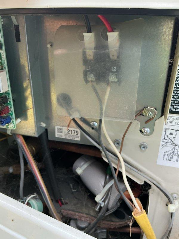 Completed comprehensive AC tune-up on 9-year-old cooling system. Inspected blower motor assembly and wheel operation, verified proper rotation and airflow. Accessed control panel, examined contactor terminals (L1/L2), inspected electrical connections and wiring integrity throughout system. All components found operating within normal parameters, system ready for cooling season.