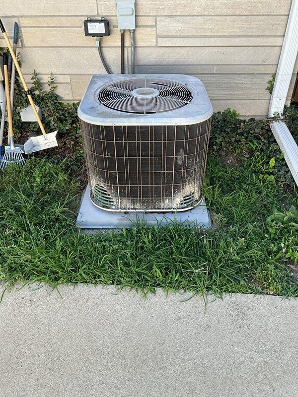 Conducted comprehensive assessment of existing HVAC system for replacement estimate. System evaluation revealed 20-year-old equipment including gas furnace and outdoor condensing unit that have reached end of expected service life. Documented current equipment specifications, installation configuration, and site conditions through detailed photography of indoor furnace unit with associated venting and outdoor condenser placement. Provided homeowner with replacement options and recommendations for new high-efficiency heating and cooling system to improve comfort and reliability.
