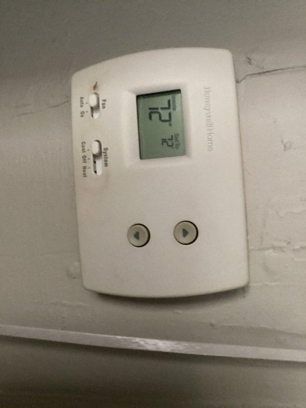 Responded to no cooling call at residential apartment unit. Upon inspection, found condensate pump in attic space operational with proper drainage setup via PVC piping. Verified thermostat displaying 74°F with system powered and responsive to controls. Checked air handler and condensate removal system, confirmed all components functioning within normal parameters and unit cooling effectively.
