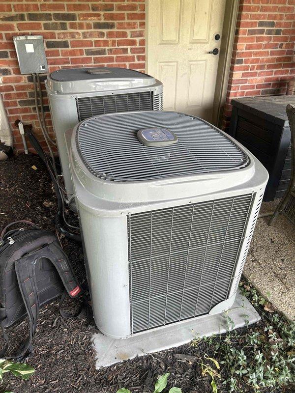 Responded to complaint of insufficient cooling from one of two HVAC systems at the property. Inspected attic-mounted air handler unit and outdoor condenser units positioned side by side on concrete pad. Performed diagnostic testing and system evaluation on the affected unit, which is less than 10 years old. Verified airflow, checked refrigerant levels, and assessed overall system performance to identify cause of reduced cooling capacity.
