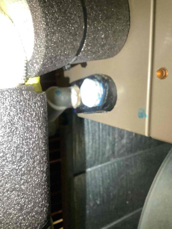Responded to service call for furnace leaking water onto floor with system shut down. Inspected 5-year-old furnace and confirmed recurring drainage issue related to improper unit leveling. Verified condensate drain line routing and checked unit pitch to ensure proper drainage flow toward drain pipe rather than onto floor, correcting previous installation deficiency that caused water accumulation.