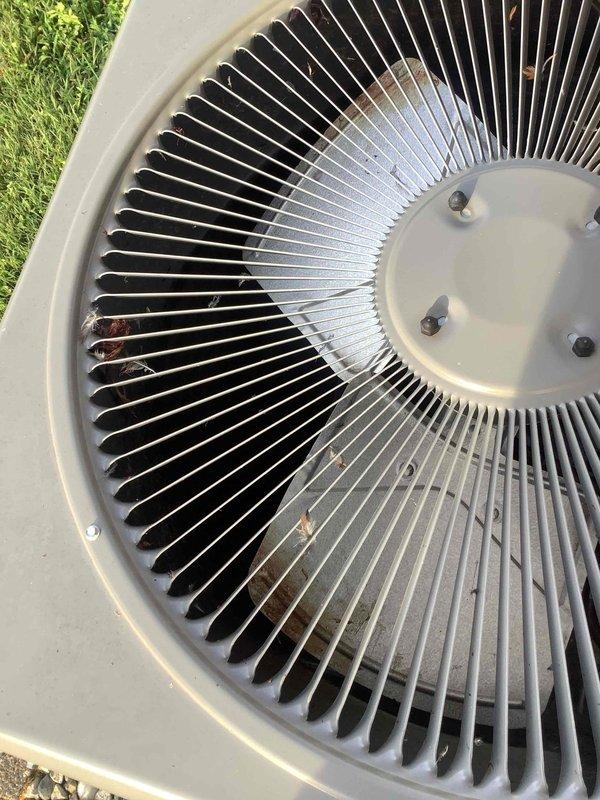 Performed air conditioning system diagnostic and testing on outdoor condensing unit. Utilized manifold gauge set to check refrigerant pressures on both high and low sides of the system, and employed digital multimeter to verify electrical readings and component operation. Inspected condenser fan assembly, noting minor debris accumulation between cooling fins, and documented unit condition with visual records for service history.