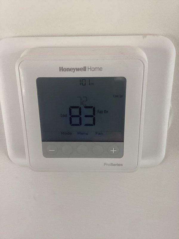 Responded to service call for heat pump system experiencing short cycling and failure to maintain operation after customer installed new Honeywell ProSeries thermostat. Verified thermostat installation, checked wiring configuration at both thermostat and air handler, and tested compressor operation and associated controls to diagnose intermittent shutdown issue.