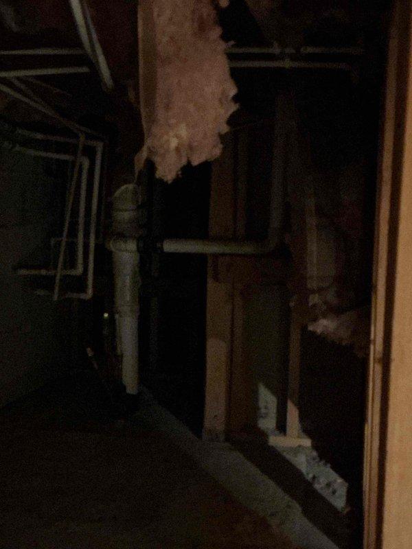 Completed prepaid plumbing inspection of residential property. Performed comprehensive visual assessment of accessible plumbing systems and components. Inspected under-sink plumbing assembly including white PVC P-trap configuration, drain pipe connections, and chrome stopper mechanism, confirming proper installation and compression fitting integrity. Examined basement or crawl space area, observing exposed piping, structural supports, and utility components. Documented all findings with photographic evidence for record-keeping purposes. All inspected plumbing components found to be functioning as intended with no immediate repairs required at time of visit.