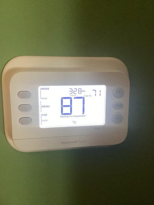 Responded to service call for non-functional thermostat control. Found Honeywell Home digital thermostat displaying "Waiting For Equipment" message with unit running but unable to accept temperature setting changes. Replaced faulty thermostat with new Robertshaw model, restoring full system control and programming capability.