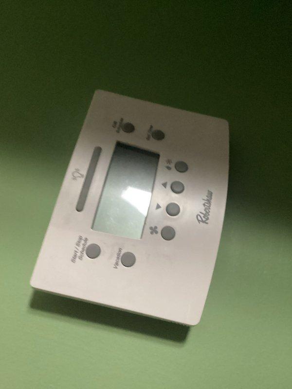 Responded to service call for non-functional thermostat control. Found Honeywell Home digital thermostat displaying "Waiting For Equipment" message with unit running but unable to accept temperature setting changes. Replaced faulty thermostat with new Robertshaw model, restoring full system control and programming capability.