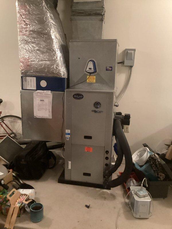 Responded to callback for system not cooling properly due to previously identified obstructed tube issue. Inspected air handler unit and REME-HALO air purification system with UV light technology to diagnose recurring cooling problem and documented equipment condition with photos for service records.
