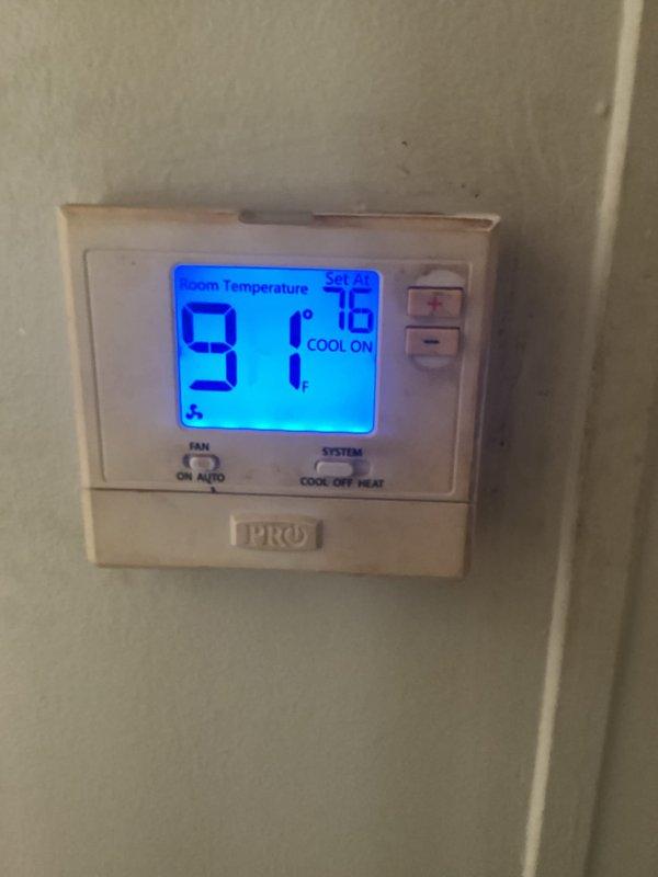 Responded to service call for air conditioning system blowing warm air. Upon arrival, found thermostat displaying 91°F with setpoint at 78°F and system actively calling for cooling. Inspected dual air handler units located in utility closet, noting significant dust accumulation on equipment surfaces and surrounding area. Performed system diagnostics and identified low refrigerant charge as primary cause of inadequate cooling. Recharged system to manufacturer specifications and verified proper operation of all components.
