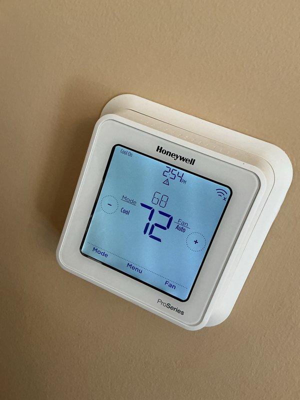Completed prepaid cooling maintenance tune-up on residential HVAC system with Performance brand furnace and air handler. Performed comprehensive inspection of indoor unit, verified Honeywell ProSeries thermostat operation showing proper cooling mode function with setpoint at 72°F and current temperature at 68°F, inspected refrigerant line connections, condensate drain system, and confirmed all safety labels and equipment specifications were intact and visible. System operating within normal parameters with no issues identified.