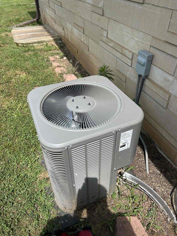 Responded to no-cooling complaint with indoor temperature reported above 87 degrees. Inspected outdoor condensing unit and accessed electrical compartment to evaluate capacitor and wiring connections. Documented unit condition and electrical components for diagnostic purposes.
