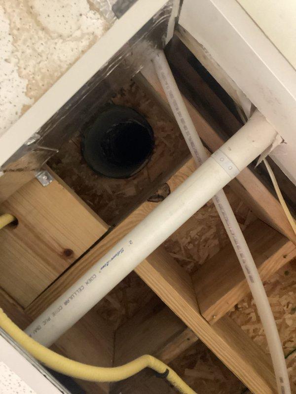 Responded to service call for HVAC system leak causing water intrusion through interior walls at commercial facility. Upon inspection, identified condensate drainage issue with system plumbing, documented existing conditions including water-damaged areas around drain lines and access points, and photographed mechanical infrastructure for assessment and recommended repairs.