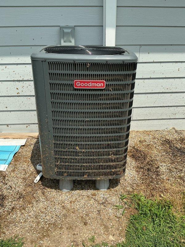 Responded to service call for new air conditioning system not maintaining adequate cooling capacity. Inspected outdoor Goodman condenser unit and verified operational status of all components. Evaluated Honeywell thermostat settings and confirmed system configuration with fan operating continuously in cooling mode at 73°F setpoint.