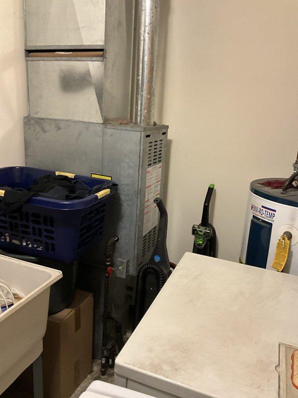 Completed HVAC estimate for air conditioning system addition to existing furnace installation. Assessment included evaluating current furnace setup, determining optimal placement for new AC unit, and identifying electrical routing requirements for proper integration of cooling system with existing heating equipment in basement utility area.