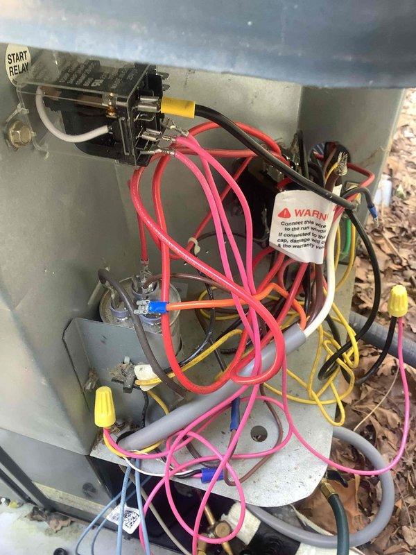 Responded to callback for system blowing hot air and experiencing intermittent operation overnight. Inspected outdoor condenser unit and control panel wiring, finding loose connections at start relay and capacitor terminals. Tightened all electrical connections, verified proper voltage at compressor contactor, and tested system operation through complete cooling cycle. Unit now operating properly with correct temperature differential and no further issues observed.